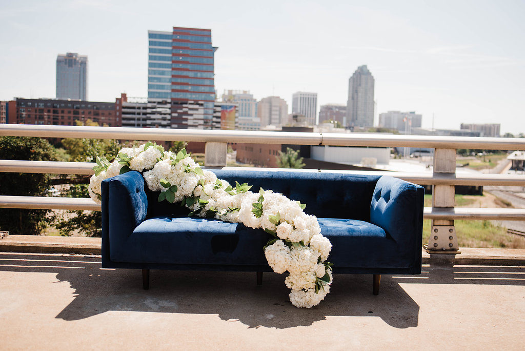 flower, porshia hernandez photography, flowers, couch, blue, royal blue, cityscape, city, raleigh, city of oaks, oak, petal, petal & oak, petal perfect, photo shoot, stylized shoot, bridge, train, train tracks, urban, urban chic, chic, florists, event designer, designer, events, party, weddings, social events, corporate events